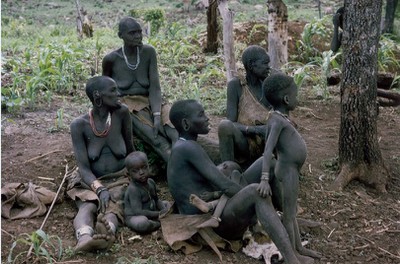 Women and children watching an argument between men