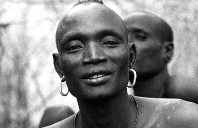 Ulikoro Konyonomora was the priest of the Dola until his death in 2012. In this photograph, he is pictured wearing the necklace of the priest, which is the priestly insignia.